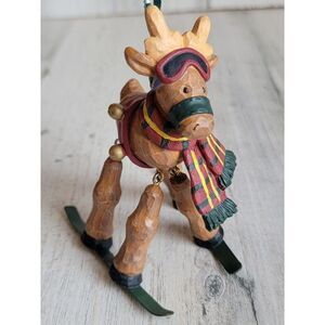 Rustic snow skiing reindeer Bell ornament Xmas jointed